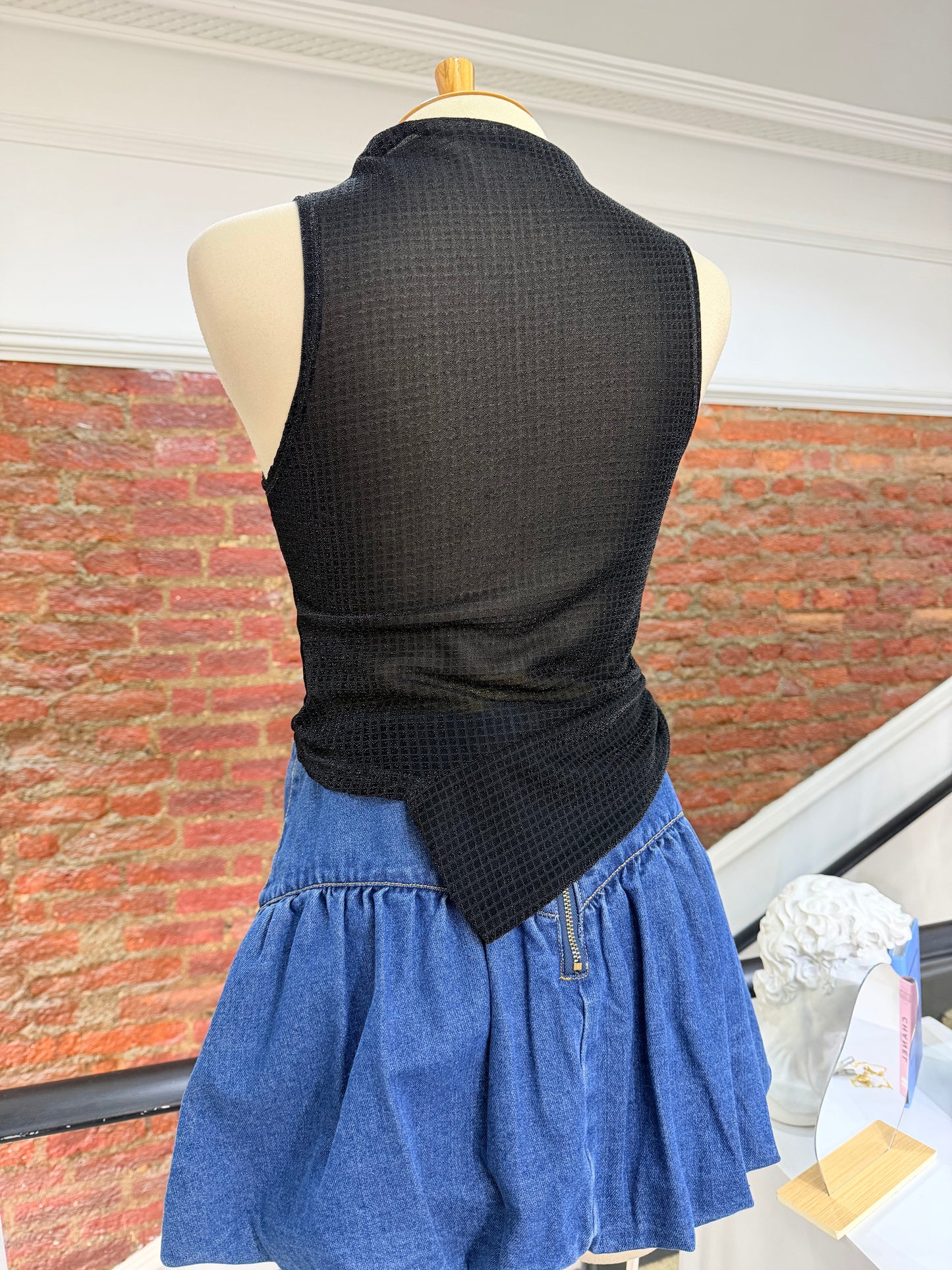 Blusa asimétrica brillante