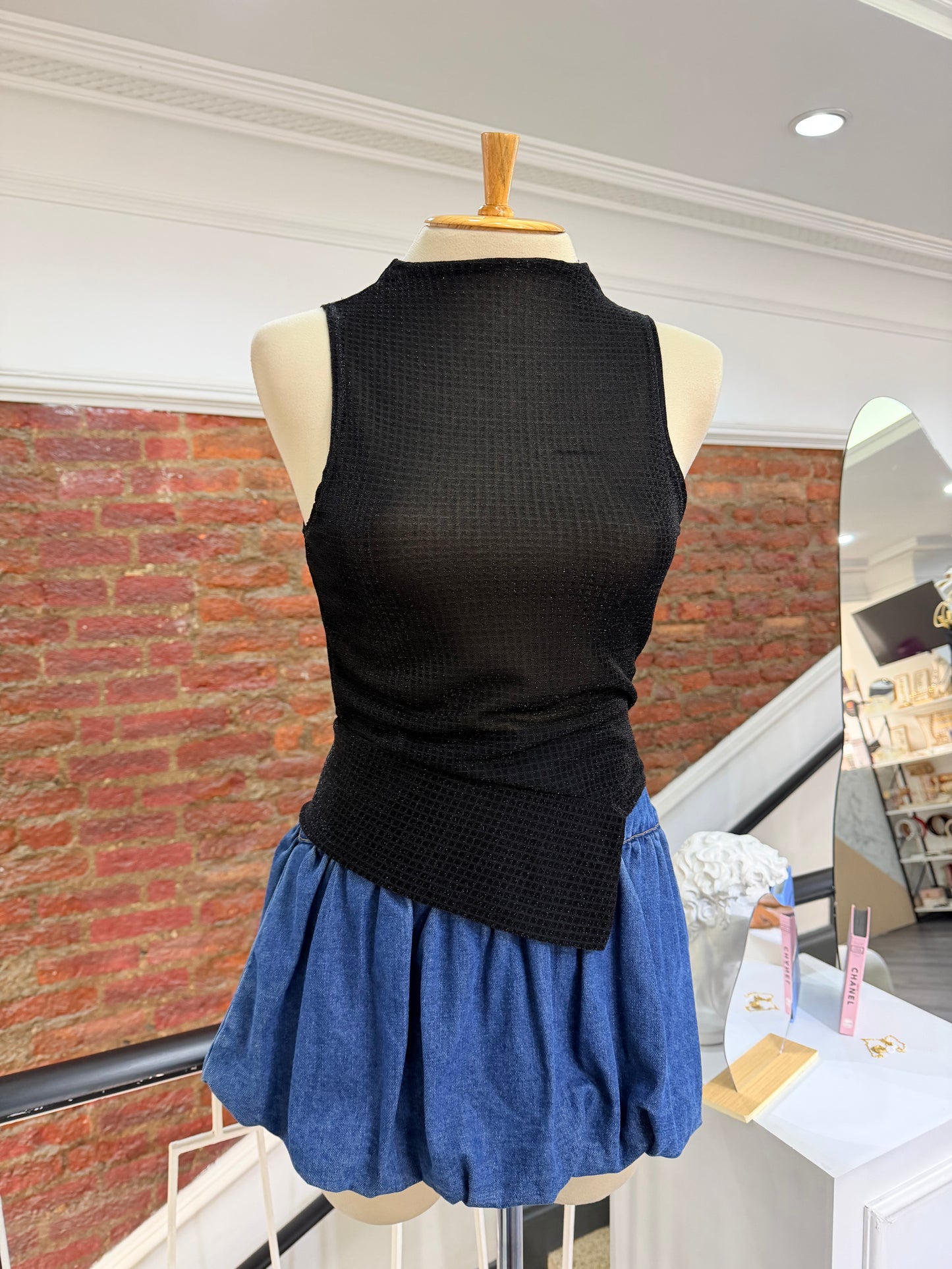 Blusa asimétrica brillante